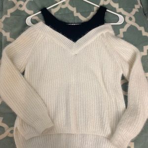 White with black tank like design sweater